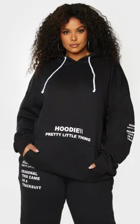 PRETTYLITTLETHING Plus Hoodie noir oversize à poche frontale et slogan imprimé